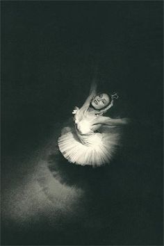 a black and white photo of a ballerina