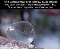 a snow globe sitting on top of a table next to a pink and white frame