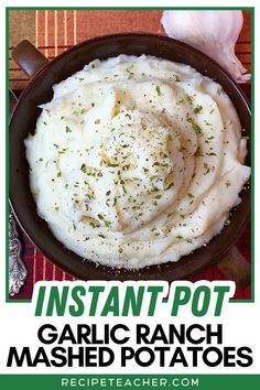 instant pot garlic ranch mashed potatoes in a cast iron skillet with text overlay that reads instant pot garlic ranch mashed potatoes