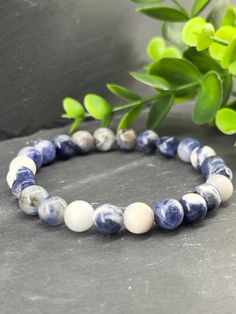 We love natural stone bracelets, to wear alone or layered with your other bracelets. Don't forget your lava stone bracelet for the aromatherapy of your essential oils in our EvanoAroma section. Description of this bracelet: - Round smooth sodalite blue natural stone beads 8mm. - Top quality Beadalon (USA) elastic. Bracelet length: 5.5 inches to 8.5 inches If you do not know your wrist diameter please refer to the explanatory sheet in the photos above to find out which bracelet size to select. Th Sodalite Round Beads Bracelets For Healing, Sodalite Beaded Bracelets With Natural Stones For Gift, Sodalite Round Beads Bracelets As Gifts, Sodalite Bead Bracelets As Gift, Adjustable Sodalite Beaded Bracelets, Precious Stones Bracelet, Wood Ceramic, Lava Stone Bracelet, Stone Bracelets