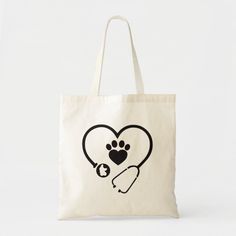 a white bag with a heart and paw print on the front that has a stethoscope in it