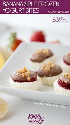 banana split frozen yogurt bites on a white plate with fruit in the background