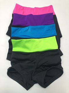 Rock out on the dance floor with these black lycra shorts with fun colored waistbands! Great for girls active in dance and gymnastics. Made of quality material and has great stretch. Available in Girls Size 7, 8, 10 and Teen XS(14). Sold as a single pair of shorts. Please see photos for size chart: Chest: Measure across the back and around the fullest part of the chest Waist: Measure around the natural waist Hips: Measure around the widest part of the hips Wash instructions: Machine wash cold wi Gymnastics Shorts, Lycra Shorts, Girls Sports, Dance Shorts, Workout Attire, On The Dance Floor, Selena Quintanilla, Neon Colors, Dance Floor