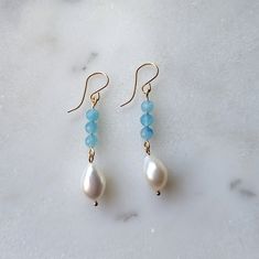 The light aqua blue color of these Peruvian Amazonite and Freshwater Pearl drop dangle earrings is absolutely dreamy! The gorgeous aqua blue Peruvian Amazonite stones pair beautifully with organically shaped freshwater pearls to give you that tropical/coastal vibe. Both the Peruvian Amazonite and Freshwater Pearls are superior AAA grade (the best you can get!) That is why the Peruvian Amazonite has that dreamy deep blue color, and the pearls have the most captivating iridescence to them. If you Aqua Blue Color, Amazonite Stone, Light Aqua, Drop Dangle Earrings, Pearl Drop, Aqua Blue, Earring Necklace, Deep Blue, Fresh Water