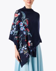 Janavi, a leading brand in unique and refined accessories, adds a colorful addition to its iconic collection. This classic navy wool scarf consists of a bright floral design, offering a polished addition to every look. Wrap this scarf around a coordinating dress for a chic date-night look. Elegant Embroidered Blue Shawl, Elegant Blue Shawl For Spring, Elegant Embroidered Shawl For Spring, Elegant Floral Embroidered Shawl For Spring, Elegant Blue Shawl For Fall, Elegant Blue Fall Shawl, Elegant Embroidered Scarves For Spring, Elegant Embroidered Spring Scarves, Elegant Embroidered Shawl For Fall