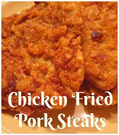 chicken fried pork steaks on a plate with the words chicken fried pork steaks