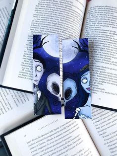 an open book with two faces on it