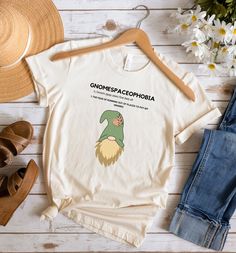 "The \"Gnome-Aholic\" t-shirt features a colorful design that showcases a mischievous gnome with intricate details and a touch of humor. Crafted from soft, high-quality fabric, this t-shirt is a must-have for those who embrace the whimsical world of gnomes with unbridled passion. .: 100% Airlume combed and ringspun cotton (fiber content may vary for different colors) .: Light fabric (4.2 oz/yd² (142 g/m .: Retail fit .: Tear away label .: Runs true to size" Gnome Gifts, Gnome Gift, Gift Bundles, Colorful Design, Intricate Details, G M, Cotton Fiber, Light Fabric, Quality Fabric