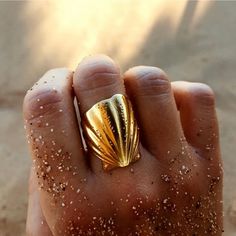 Get ready to dive into endless summer vibes with our Big Shell Open Ring. Inspired by the sea and the beach, this unique piece will bring a touch of the ocean to your style. Perfect for those who love to embrace their inner beach babe and channel those beachy vibes wherever they go. Metal: 18K Gold over Stainless Steel Size: Adjustable/ as is fits size 7 Beach Rings, Ocean Ring, Formal Jewelry, Shell Ring, Chunky Rings, Shell Bracelet, Men's Jewelry Rings, Stainless Steel Earrings, Open Ring