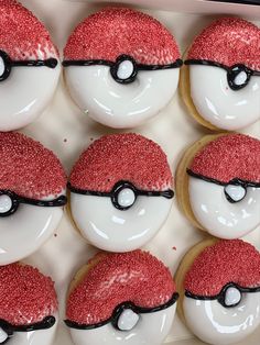 there are many decorated donuts with red sprinkles in the shape of pokemon eyes