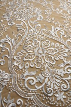 "This stunning Lace Fabric design piece has soft hand feel, It's perfect for weddings, bridal parties, and any events. Shop our large inventory of bridal fabrics. ☆PRODUCT DESCRIPTION : This gorgeous fabric is made on a sheer base with a beautiful vintage embroidery throughout. The fabric width is approximately 51\" (130cm) Wide. Color: off-white or beige as in picture Material: Rayon, Polyester，Sequins ☆ PURCHASING INFORMATION: This fabric is sold by the yard and each Qty you enter will represe Gold Embroidered Lace Fabric For Wedding, Wedding Lace Fabric With Gold Embroidery, Cream Embroidered Fabric For Ceremony, Ceremony Cream Embroidered Fabric, Cream Wedding Fabric With Intricate Embroidery, White Embroidered Fabric For Reception, Wedding Cream Embroidered Fabric With Intricate Details, Elegant 3d Embroidered Lace For Wedding, Elegant 3d Embroidery Lace For Wedding