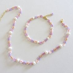 Colorful pearl beaded necklace Beaded flower necklace Freshwater pearl necklace Beaded choker Daisy chain necklace delicate jewelry 24k gold plated brass chain and clasp. The necklace is made with 10/0 size glass beads, lilac, powder, pink pearl and gold colors, and with freshwater pearls. Measure the length of your neck with a measuring tape or you can use any thread, rope, or cable for telephone and after apply the measurements to a regular ruler. A cute and elegant daisy necklace with pearls will add a little touch to your casual and holiday attire! Lobster clasp and extension for length adjustment and easy removal. Pink Flower Beaded Necklace, Pretty Pearl Necklace, Pink Beaded Jewelry, Cute Pearl Necklace, Daisy Chain Necklace, Beaded Flower Necklace, Pretty Jewelry Necklaces, Preppy Jewelry, Pearl Beaded Necklace