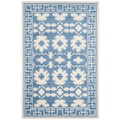 a blue and white rug with an intricate design