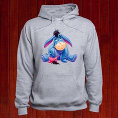 Disney Winnie The Pooh Character Eeyore Hoodie. The Disney Eeyore Vacation Jumper that goes with anything! Hopefully this Family Disney Trip Hoody will be a great purchase for yourself or a gift for someone close to you. Fun, casual, or as a workout sweatshirt says in a trendy graphic. We use a professional DTG printing process to ensure that the Disney World Eeyore Jumper design won't fade or crack. * SIZE * Please refer to our size chart in the photos of products for exact dimensions. (All mea Eeyore Birthday, Eeyore Sweatshirt, Cute Eeyore, Piglet Disney, Winnie The Pooh Eeyore, Birthday Sweater, Winnie The Pooh Piglet, Cute Piglets, Pooh Piglet