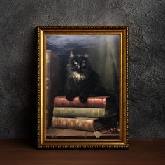 a black cat sitting on top of some books in a gold framed photo with a dark wall behind it