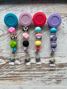 Silicone Beaded Badge Reel. Show your individual style with these super cute beaded badge reels.   Silicone beads are lightweight, BPA free and easy to clean.   Alligator Swivel Clip. Multicolor Beaded Badge Reel As Gift, Adjustable Multicolor Retractable Badge Reel, Multicolor Retractable Badge Reel For Gift, Adjustable Retractable Multicolor Badge Reel, Multicolor Retractable Badge Reel, Fun Multicolor Adjustable Badge Holders, Silicone Bead Badge Reel, Diy Pens, Beaded Badge Reel