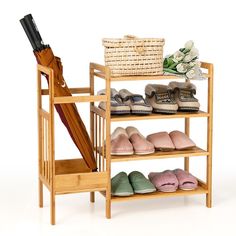 a wooden shelf filled with shoes and an umbrella