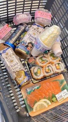 a shopping cart filled with assorted foods and condiments for sushi rolls