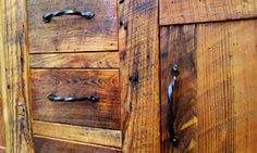 an old wooden cabinet with metal handles and knobs