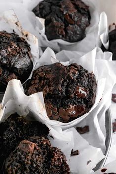 chocolate muffins in white paper bowls with text and so yummm?