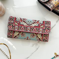 This Boho wallet is made of Turkish carpet patterned brocade fabric and vegan leather. Its ethnicity and elegance comes from the traditional Turkish carpet motives used on the front and the back. These kilim wallets are designed and made in Cappadocia,Turkey. Cappadocia is known for its distinctive "fairy chimneys," tall, cone-shaped rock formations. Besides these natural beauties, Cappodocia is famous with Its wine, horses, hot air balloons and handwoven carpets. The designs of our wallets are Vintage Multicolor Wallet For Daily Use, Bohemian Multicolor Wallets For Daily Use, Bohemian Multicolor Wallets As Gifts, Handmade Bohemian Wallets For Daily Use, Bohemian Wallet With Card Slots For Daily Use, Bohemian Multicolor Coin Purse For Daily Use, Bohemian Rectangular Wallet For Festivals, Bohemian Wallets With Card Slots For Everyday Use, Turkey Cappadocia