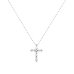 Faith meets fashion in this graceful diamond cross pendant. Crafted in stunning .925 sterling silver, this feminine style crosses two single rows of shimmering prong-set diamonds to create an elegant design. Inspiring with 11 natural, sparkling diamonds weighing 1.00 ct. t.w. of diamonds and a brilliant buffed luster, this pendant suspends along an 18.0-inch rope chain. Classic Diamond White Cross Necklace, Classic Cross Necklace With Diamond Accents, Classic Diamond White Cross Necklace With Cubic Zirconia, Classic Diamond White Cubic Zirconia Cross Necklace, Classic Cubic Zirconia Cross Necklace In Diamond White, Classic Diamond White Cross Necklace For Anniversary, Classic Cubic Zirconia Cross Necklace, Classic Diamond Cross Pendant Necklace, Diamond Cross Pendants