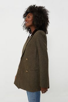 The perfect outfit topper for brisk mornings and in-office days, the Wool Tweed Holland Blazer is elegant yet effortlessly cool. With strong structured shoulders, a chic lapel collar with velvet detailing, and a double-breasted front closure, this classic, boxy-yet-tailored silhouette is a must-have for the season. Pair it with trousers or a mini skirt for an elevated ensemble, or with a crisp white tee and denim for weekend wear! Notched lapels Velvet detail at back of collar Long sleeves with Business Casual Outfits For Work, Cocktail Attire, Tweed Fabric, Weekend Wear, Business Casual Outfits, White Tee, Gold Buttons, Pullover Sweatshirts, Lapel Collar