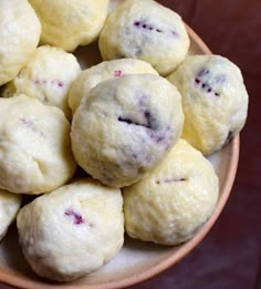 a bowl filled with cookies on top of a table