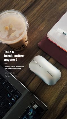 there is a laptop, mouse and coffee on the table