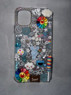 a cell phone case with many different items on it