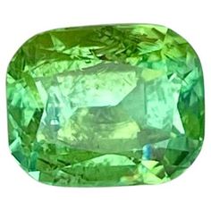 an oval shaped green diamond on a white background