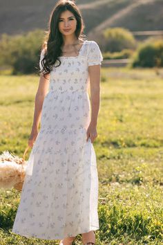 Shop the Elsie Smocked Maxi Dress - Floral smocked maxi dress with short sleeves. This white puff sleeve dress is bump friendly! Sequin Babydoll Dress, White Puff Sleeve Dress, Chinese Fancy Dress, Smocked Maxi Dress, Modest Maxi Dress, White Floral Maxi Dress, Short Maxi Dress, Modest Maxi, Dress With Short Sleeves