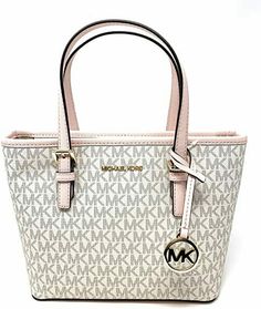 Michael Kors Jet Set Travel XS Carryall Tote Top Zip Satchel Shoulder Bag PVC Leather MK Signature Vanilla Pink This Carryall Tote is quite Small.  It is listed as a Extra Small on the Michael Kors Tag.  Please Pay attention to the Approximate dimensions of this bag below before Purchasing. Example--This tote is only 7.5 inches in Height. Approximate Dimensions---10.5"(top) 9"(bottom) x 7.5" (H) x 4.25"(D)  100% Authentic or your Money Back==Always  Gold Toned Hardware Michael Kors Logo at Front Michael Kors Store, Sac Michael Kors, Small Travel Bag, Carryall Tote, Travel Outfits, Zip Tote, Prada Handbags, Purses Michael Kors, Handbags Michael Kors