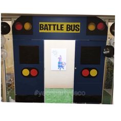 an entrance to a battle bus themed room