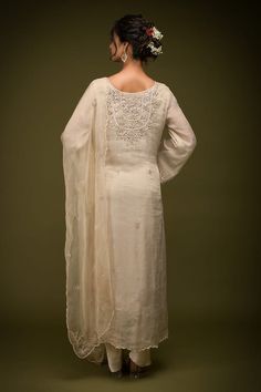 Ivory and beige kurta with cutdana embroidered floral jaal patterns embellished by mirrorwork. Comes with dhoti pant, inner and dupatta. - Aza Fashions Beige Raw Silk Sets With Dabka Details, Beige Raw Silk Dabka Sets, Beige Dabka Raw Silk Set, Cream Raw Silk Kurta With Traditional Drape, Elegant Beige Sharara For Festivals, Cream Chanderi Traditional Wear With Dabka, Cream Kurta With Dabka Embroidery, Beige Raw Silk Kurta With Naqshi, Beige Churidar With Zari Work In Traditional Drape