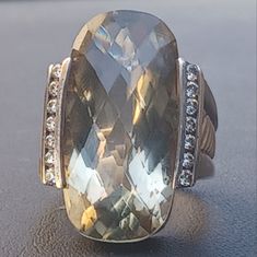 Simply Stunning And Bold, David Yurman Albion Deco Ring. There Is A Huge Cushion Cut Smoky Quartz Surrounded On Both Sides By Channel Set Diamonds. The Quartz Measures About 22 X 12mm. There Are 7 Diamonds On Each Side, But I Am Unsure Of Carat Weight. The Band Is Sterling Silver And Has A Classic Cable Design All Around It. Inside The Ring, It Is Stamped Dy 925. This Is A Size 8, But The Band Is Thick. This Comes With Dy Pouch As Pictured. This Piece Is In Very Good Pre-Owned Condition With Lig Dazzling Silver Rings For Evening, Silver Hallmarked Rings For Evening, Silver Gemstone Rings For Evening, David Yurman Jewelry, Deco Ring, Brown Silver, Channel Set, David Yurman, Smoky Quartz