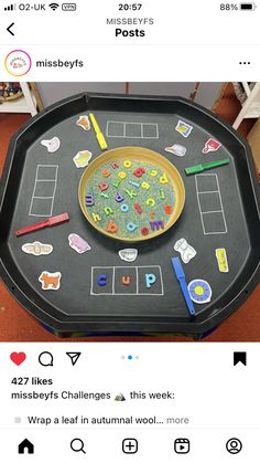 a black tray with writing and pictures on it