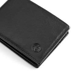 This sleek and slim wallet for men is elegant in its simplicity, yet roomy enough for all of your essentials. The exterior is crafted with smooth black leather. Inside are four slots for credit cards along with two spots for your ID. One large compartment holds your paper money, receipts, etc. Gift box is included. Minimalist Trifold Wallet With Rfid Blocking, Classic Black Trifold Wallet For Business, Minimalist Black Business Wallets, Minimalist Leather Wallet For Business, Minimalist Leather Business Wallet, Modern Black Wallet With Smooth Grain, Minimalist Business Wallets With Interior Card Slots, Minimalist Trifold Wallet With Interior Card Slots For Business, Minimalist Bifold Wallet For Formal Occasions