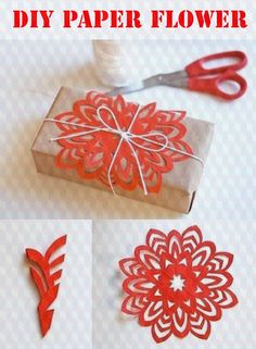 some red paper cut outs sitting on top of a white table next to scissors and a box