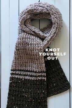 a knitted scarf with the words knot your self out