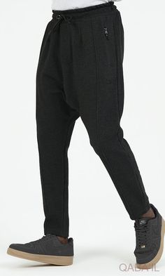 QL Relaxed Trousers City in Black Description: QL Relaxed Trousers City are meant for comfort and style. Another sporty classic outfit that is movable and breathable. Designed with an elastic waistband with an adjustable drawstring for a custom fit and zipped side pockets. These trousers are structured and unfussy, perfect for any casual day with a sporty and active vibe. Modern Islamic clothing for men Very high-quality fabric from top brands Elastic waist with drawstring closure With two side Solid Color Casual Bottoms For Business Casual, Black Relaxed Fit Bottoms For Business Casual, Black Casual Pants With Loosely Fitted Hips, Winter Casual Stretch Bottoms, Casual Black Pants With Loosely Fitted Hips, Casual Stretch Bottoms For Winter, Casual Straight Comfort Stretch Sweatpants, Casual Comfort Stretch Straight Sweatpants, Casual Stretch Tapered Leg Pants