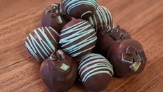 chocolate covered candies are arranged on a wooden table