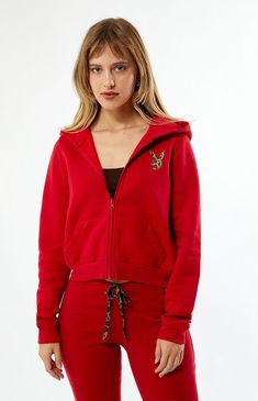 PacSun exclusive! Cozy up in effortless style with the Playboy By PacSun Leopard Applique Zip Up Hoodie. Crafted from garment-dyed fabric, it features long sleeves, an attached hood, full zipper closure, side hand pockets, and a bold leopard print Playboy Bunny applique on the back.Solid color hoodieSoft fleece liningGarment dyed fabricLong sleevesAttached hoodFull zipper front closureLeopard print Playboy bunny applique on the backSide hand pocketsRibbed cuffs and hem60% cotton, 40% polyesterMachine washableModel is wearing a size smallModel measurements: 5’7” height, 32” bust, 23” waist, 34” hip Playboy Womens By PacSun Leopard Applique Zip Up Hoodie - Red size Small Bunny Applique, Playboy Bunny, Red Hoodie, Dyed Fabric, Pacsun, Front Zipper, Effortless Style, Leopard Print, Zip Ups