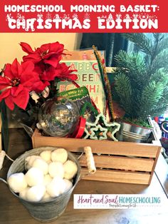 a wooden crate filled with white balls and poinsettis on top of a table