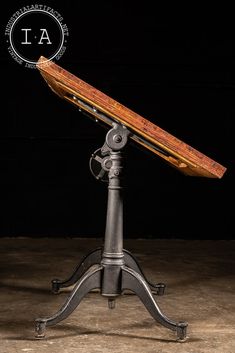 an old fashioned telescope sitting on top of a metal stand