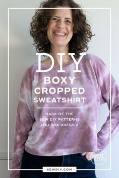 a woman standing in front of a wall with the words diy boxy cropped sweatshirt