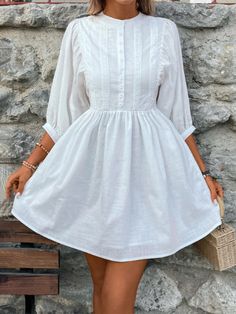 Transform into a vision of elegance with our Lace Detail Half Button Three-Quarter Sleeve Dress. Perfect for summer, this casual white dress features delicate lace detailing and a flattering half button design. Elevate your wardrobe and turn heads wherever you go! This product typically ships in 5-10 days. Features: Buttoned, Lace Detail Sheer: Opaque Stretch: No stretch Body: Not lined Material composition: 100% polyester Care instructions: Machine wash cold. Tumble dry low. Imported Size US Le Beautiful White Dresses, Three Quarter Sleeve Dresses, Loungewear Dresses, Two Piece Swimwear, Maxi Dress Cocktail, Outerwear Outfit, Maxi Dress Formal, Classic Dress, Dress With Cardigan