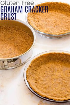 three pie pans filled with graham cracker crust on top of a white counter