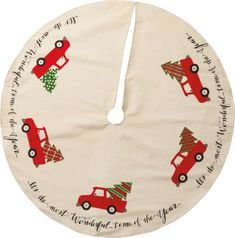 a christmas tree skirt with cars and trees on it