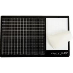 a black cutting board with a piece of paper on it